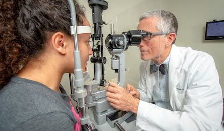Dr. Hickey eye exam with a patient