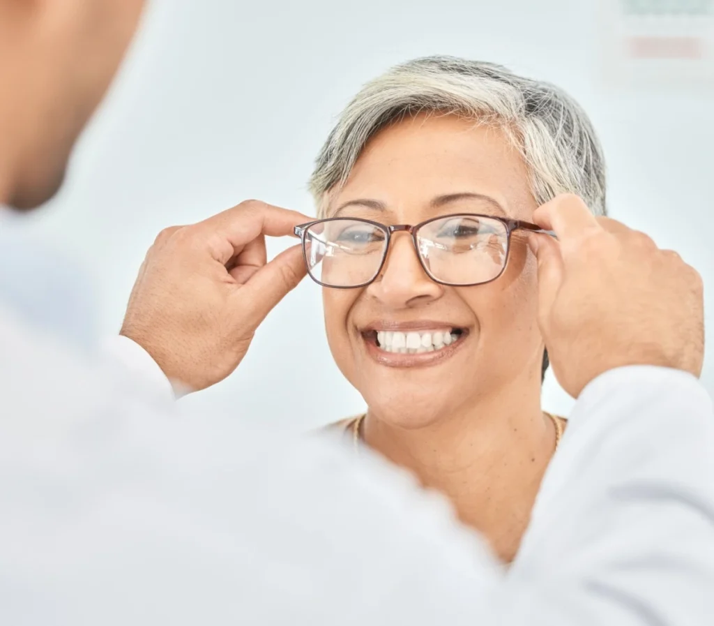 patient trying on new glasses at the optical shop